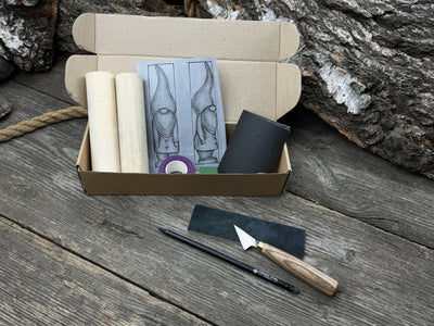 Gnome Carving Kit with carving knife, wooden blocks, sandpaper, sharpening board, pencil, and gnome drawing template