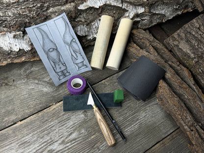 Gnome Carving Kit with carving knife, wooden blocks, sandpaper, sharpening board, pencil, and gnome drawing template