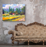 Impressionist-style canvas depicting a vibrant field with tall green trees and a small red-roofed building under a cloudy sky, hanging above a carved vintage sofa.