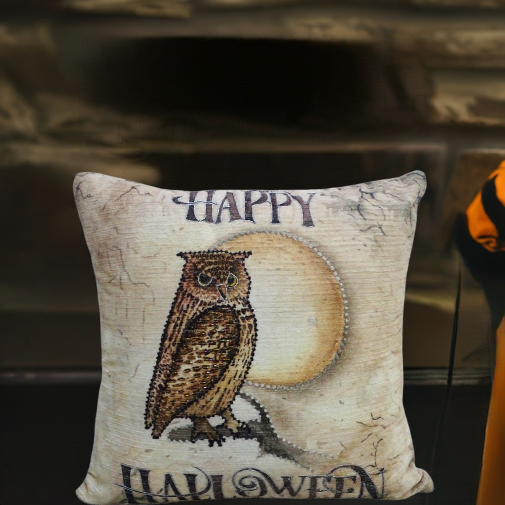 Square decorative throw pillow with a detailed owl perched in front of a large pale moon and the words 'Happy Halloween' on a cracked beige background.