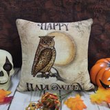 Square beige pillow with a brown owl perched on a branch in front of a large yellowish full moon and 'Happy Halloween' text in vintage style.