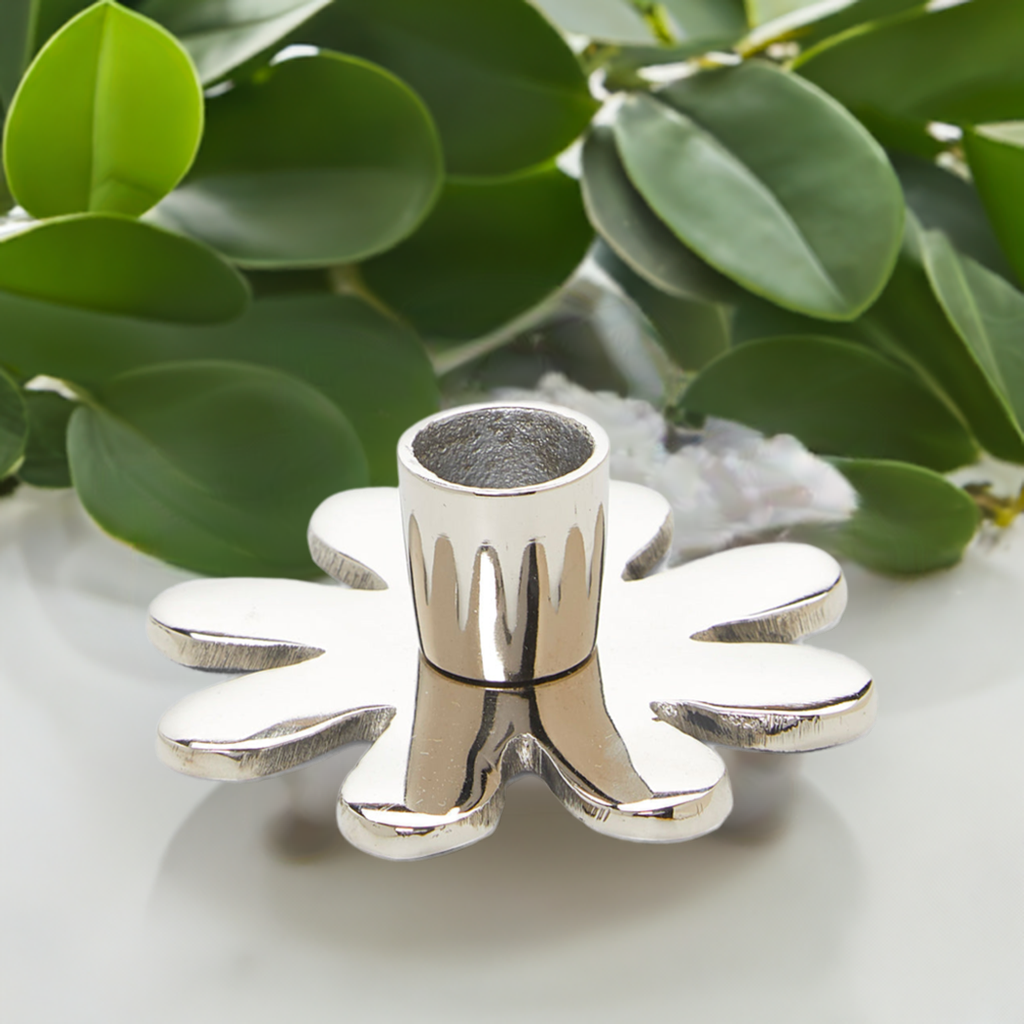 Decorative Silver Flower Candle Holder with a gleaming, smooth surface and flower shape
