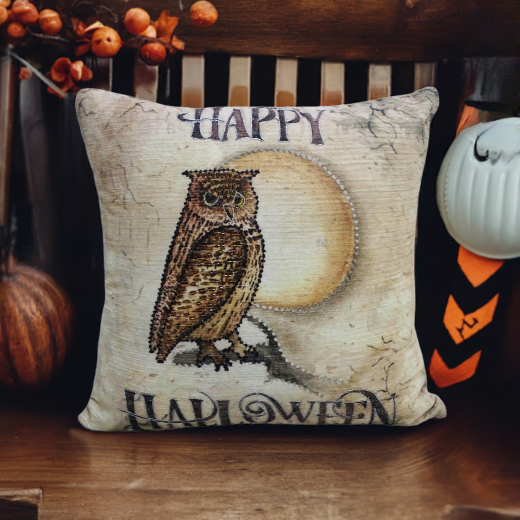 Square throw pillow with a vintage-style illustration of a brown owl in front of a full moon, with 'Happy Halloween' text in dark decorative font.