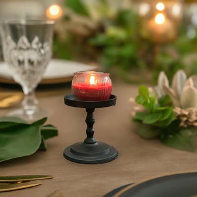 Matte black metal pillar candle holder by Vibhsa displaying a cylindrical shape with a smooth, slightly reflective surface