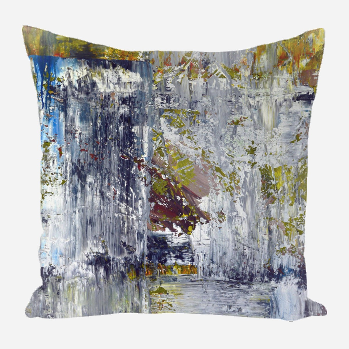 Square pillow with abstract design featuring dominant shades of gray and white, accented by patches of green, blue, and muted brown in textured brushstroke patterns.