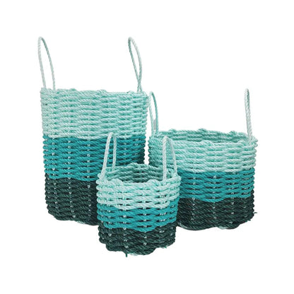 Handmade lobster rope storage baskets in hunter green, teal, and seafoam colors, shown in three sizes