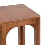 Close-up of Dahl square wood tea table corner with smooth rounded edges and arched cutout design on the leg, featuring warm natural brown wood grain.