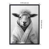 Black and white framed photo of a sheep facing forward, wrapped in a fluffy white bathrobe with a plain background.