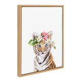 Framed canvas showing a tiger cub with light blue eyes wearing a crown of pink and white flowers with green leaves against a white background.