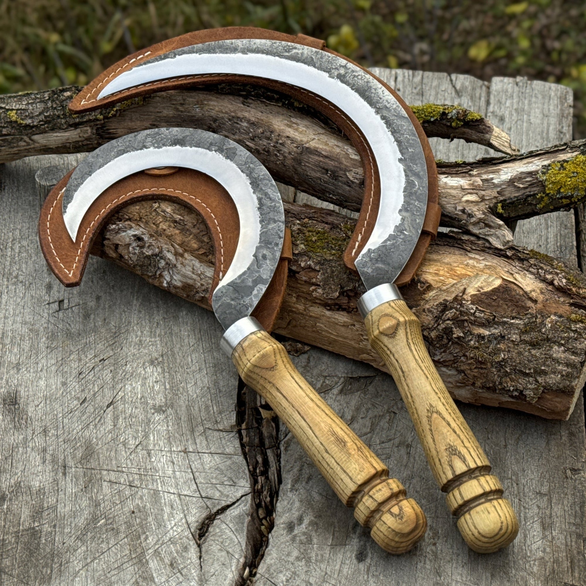 Hand-forged 2-piece sickle set with wooden handles and leather sheaths