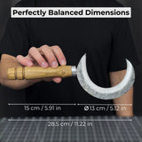 Hand-forged ritual witch sickle with crescent-shaped steel blade and wooden handle, including leather sheath