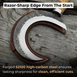 Hand-forged ritual witch sickle with crescent-shaped steel blade and wooden handle, including leather sheath