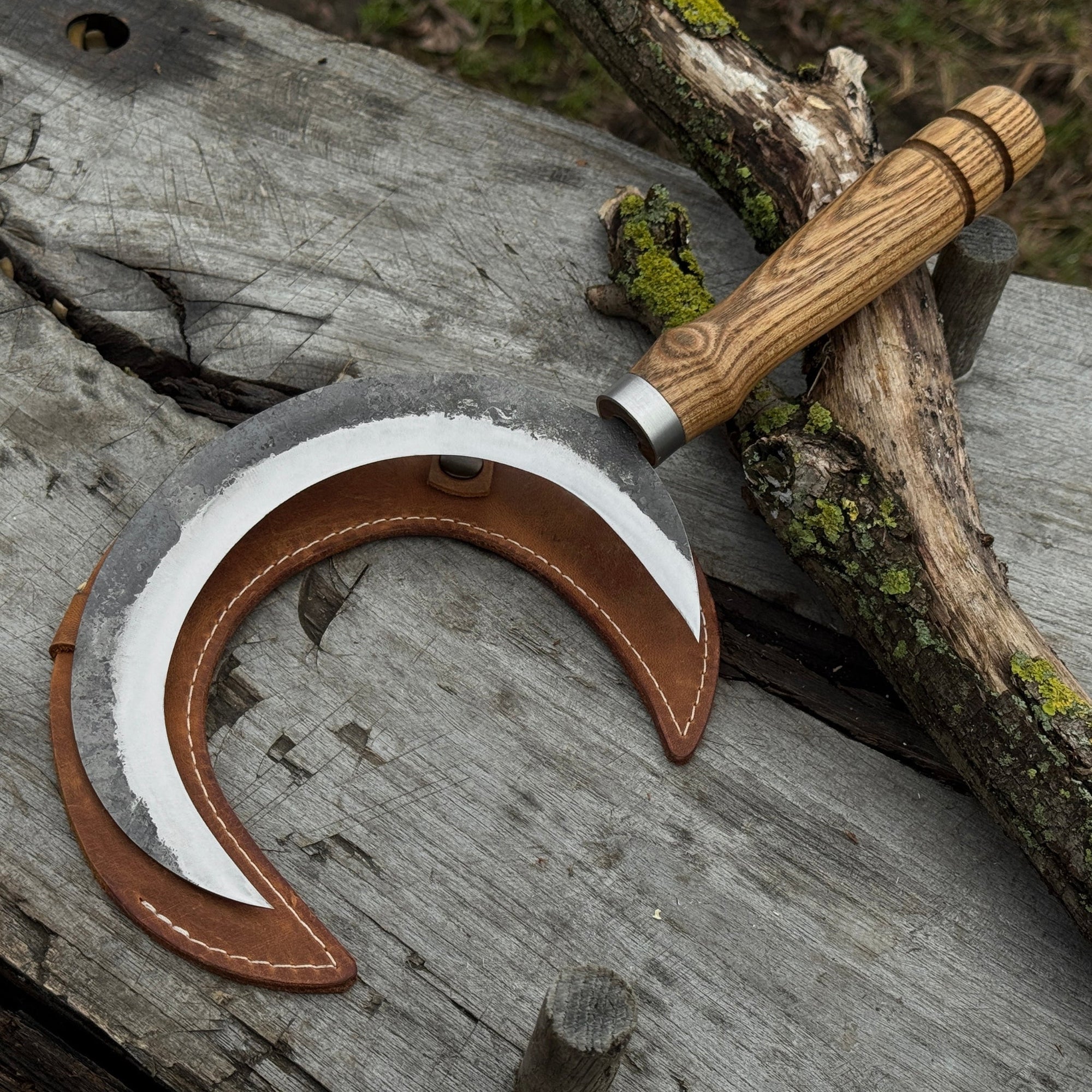 Hand-forged athame ritual witch sickle with crescent steel blade and wooden handle, including leather sheath