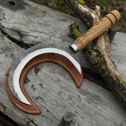 Hand-forged athame ritual witch sickle with crescent steel blade and wooden handle, including leather sheath
