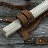 Hand-forged bushcraft hatchet with leather back sheath and ash handle