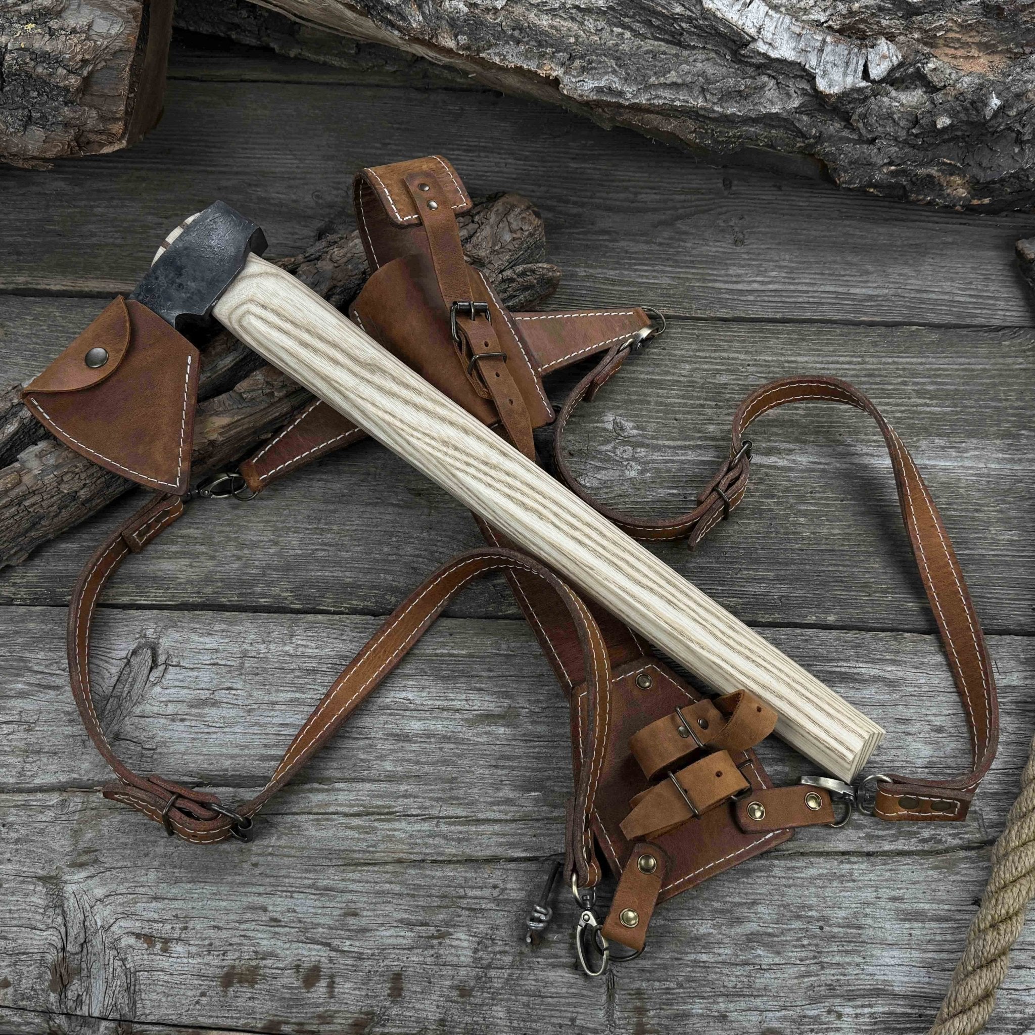 Hand-forged bushcraft hatchet with leather back sheath and ash handle