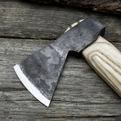 Hand-forged bushcraft hatchet with leather back sheath and ash handle