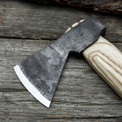 Hand-forged bushcraft hatchet with leather back sheath and ash handle