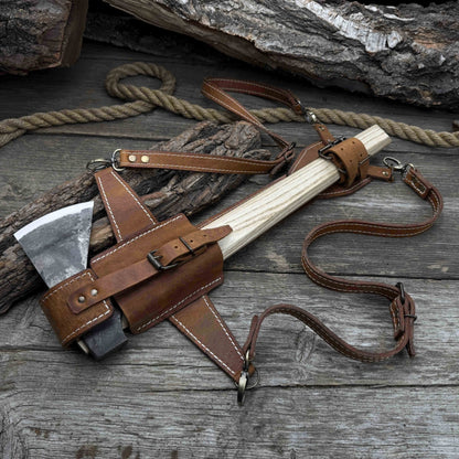 Hand-forged bushcraft hatchet with leather back sheath and ash handle