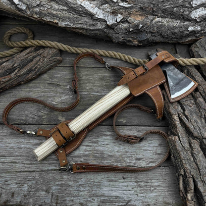 Hand-forged bushcraft hatchet with leather back sheath and ash handle
