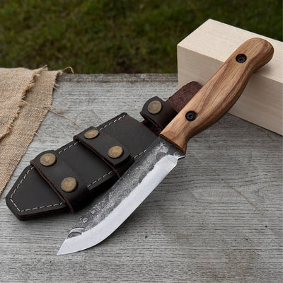 Hand-forged bushcraft knife with 10 cm blade and leather sheath by Sharky Forged Steel Tools