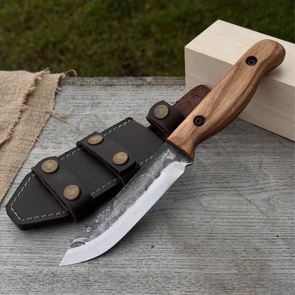 Hand-forged bushcraft knife with 10 cm blade and leather sheath by Sharky Forged Steel Tools