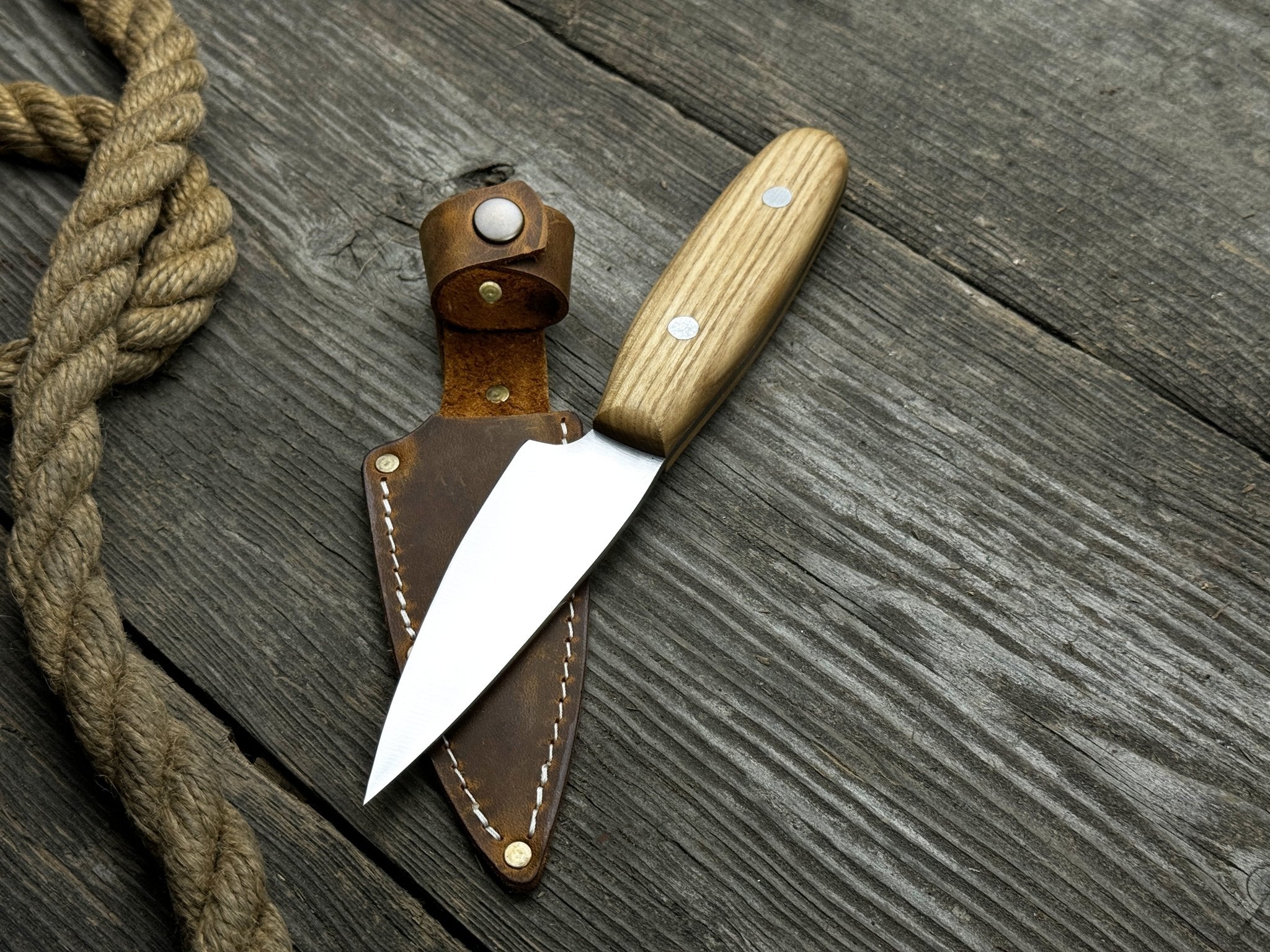 Hand-Forged Bushcraft Knife with 10 cm carbon steel blade and ash wood handle