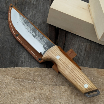 Hand-forged bushcraft knife with 12 cm carbon steel blade and ash wood handle by Sharky Forged Steel Tools