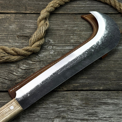 Hand-forged bushcraft knife with carbon steel blade and ash wood handle by Sharky Forged Steel Tools