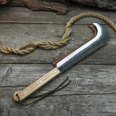 Hand-forged bushcraft knife with carbon steel blade and ash wood handle by Sharky Forged Steel Tools