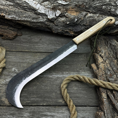 Hand-forged bushcraft knife with carbon steel blade and ash wood handle by Sharky Forged Steel Tools