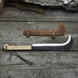 Hand-forged bushcraft knife with carbon steel blade and ash wood handle by Sharky Forged Steel Tools