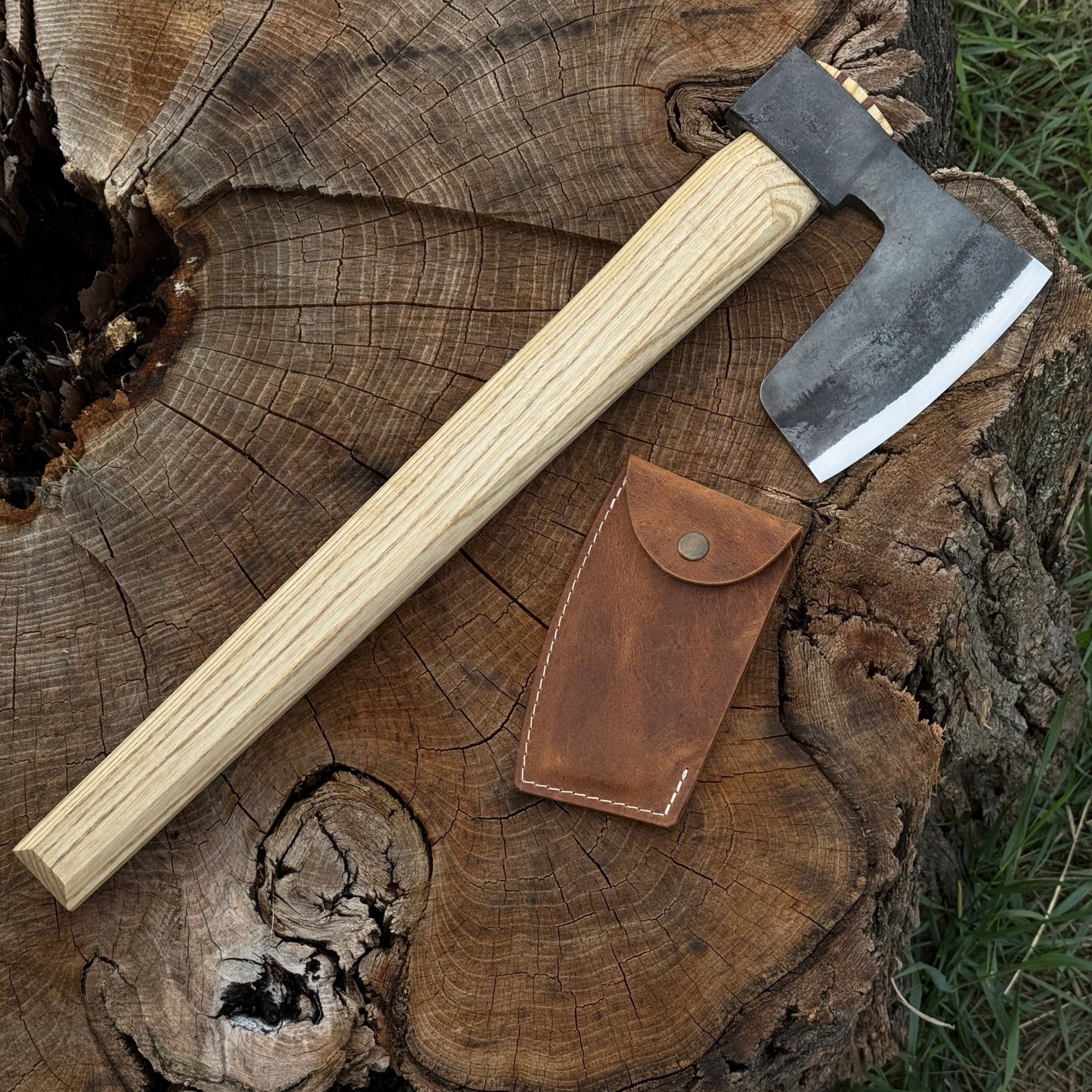Hand-forged carpenter's axe with leather sheath and ash wood handle