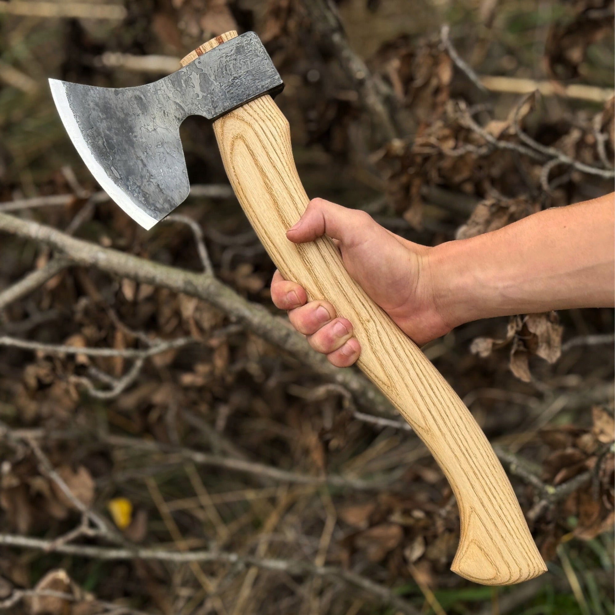 Hand-forged carving axe with ash wood handle and leather sheath
