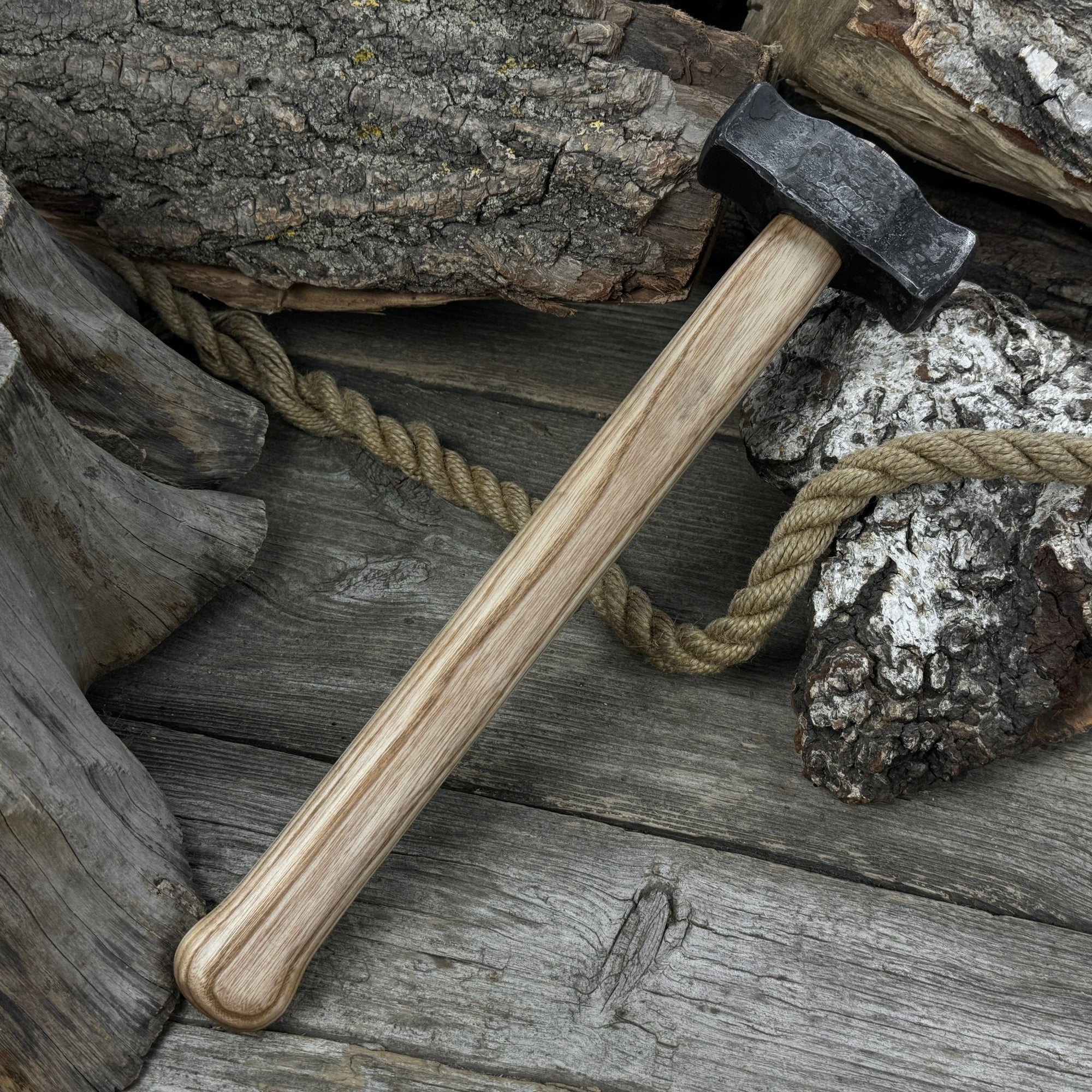 Hand-forged double blacksmith's hammer with ash wood handle and carbon steel head