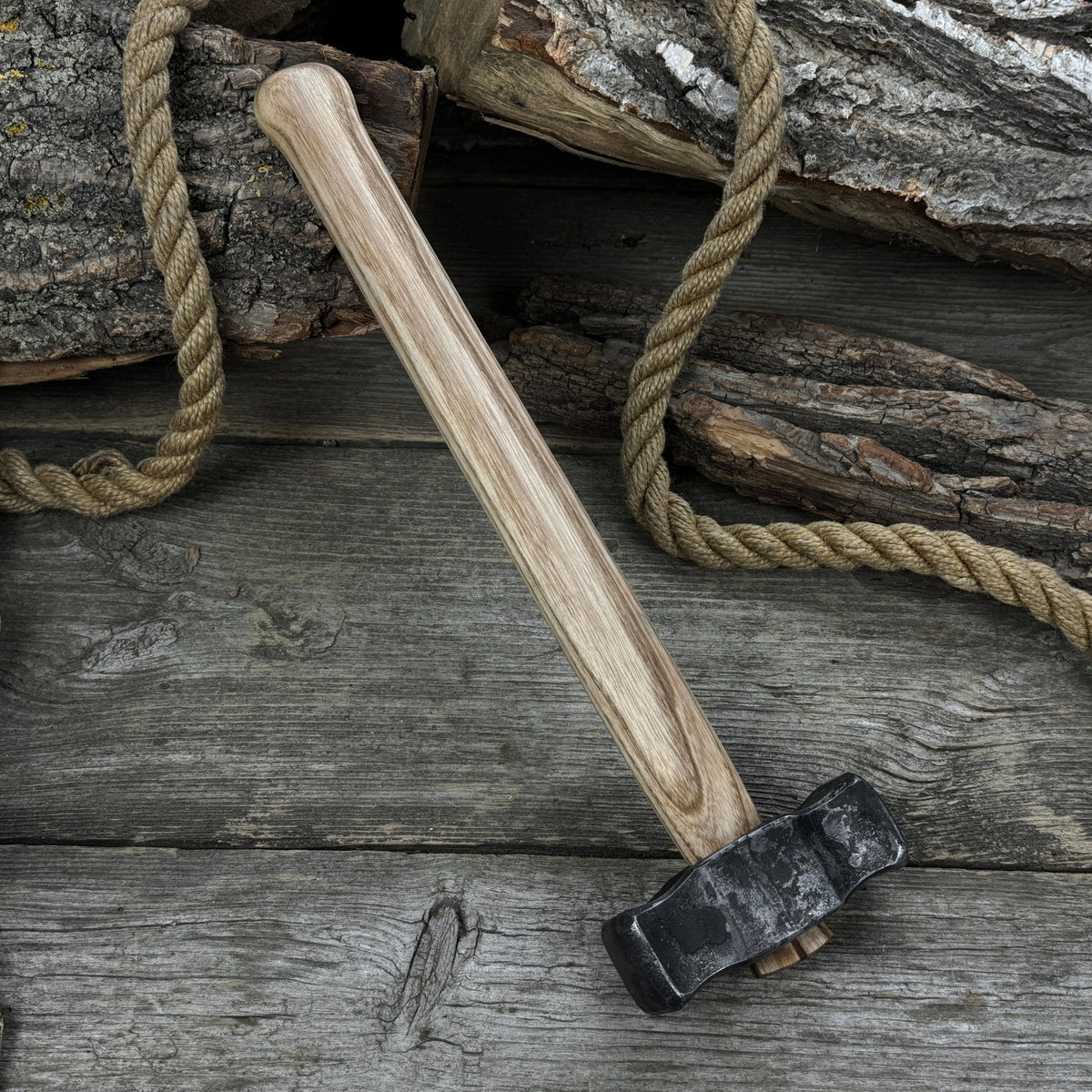Hand-forged double blacksmith's hammer with ash wood handle and carbon steel head