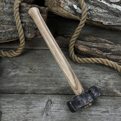 Hand-forged double blacksmith's hammer with ash wood handle and carbon steel head
