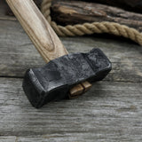 Hand-forged double blacksmith's hammer with ash wood handle and carbon steel head