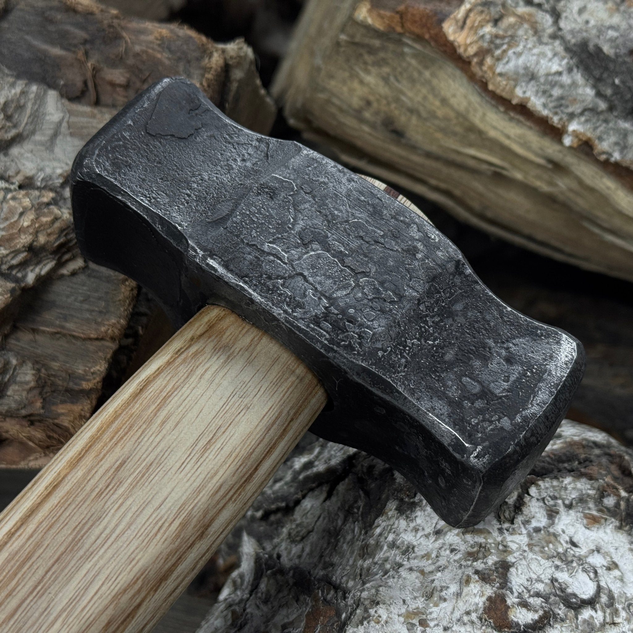 Hand-forged double blacksmith's hammer with ash wood handle and carbon steel head