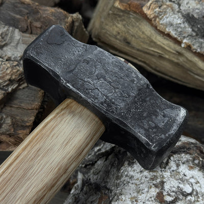 Hand-forged double blacksmith's hammer with ash wood handle and carbon steel head