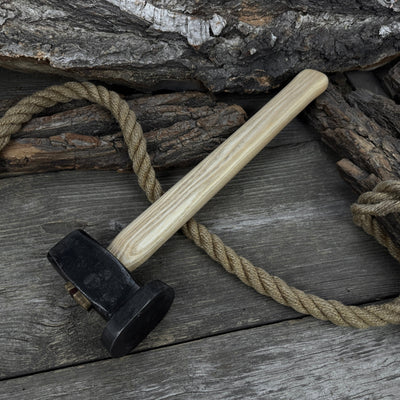Hand-forged double blacksmith's hammer with ash wood handle weighing 1.5 kg