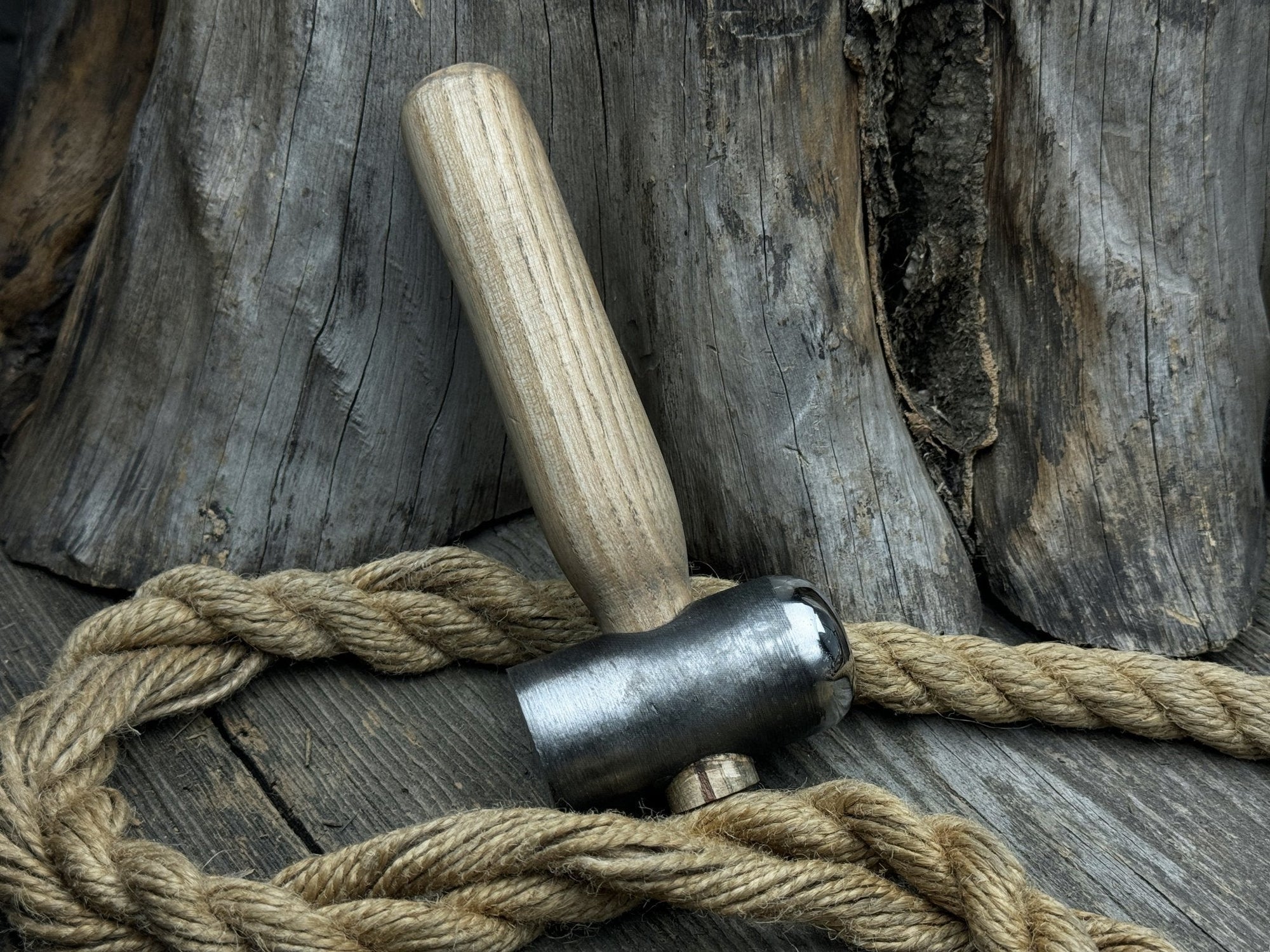 Hand-forged leather hammer with carbon steel head and ash wood handle