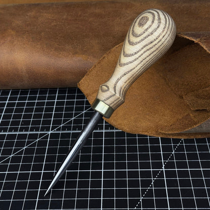 Hand-forged leatherworking awl with ash wood handle by Sharky Forged Steel Tools