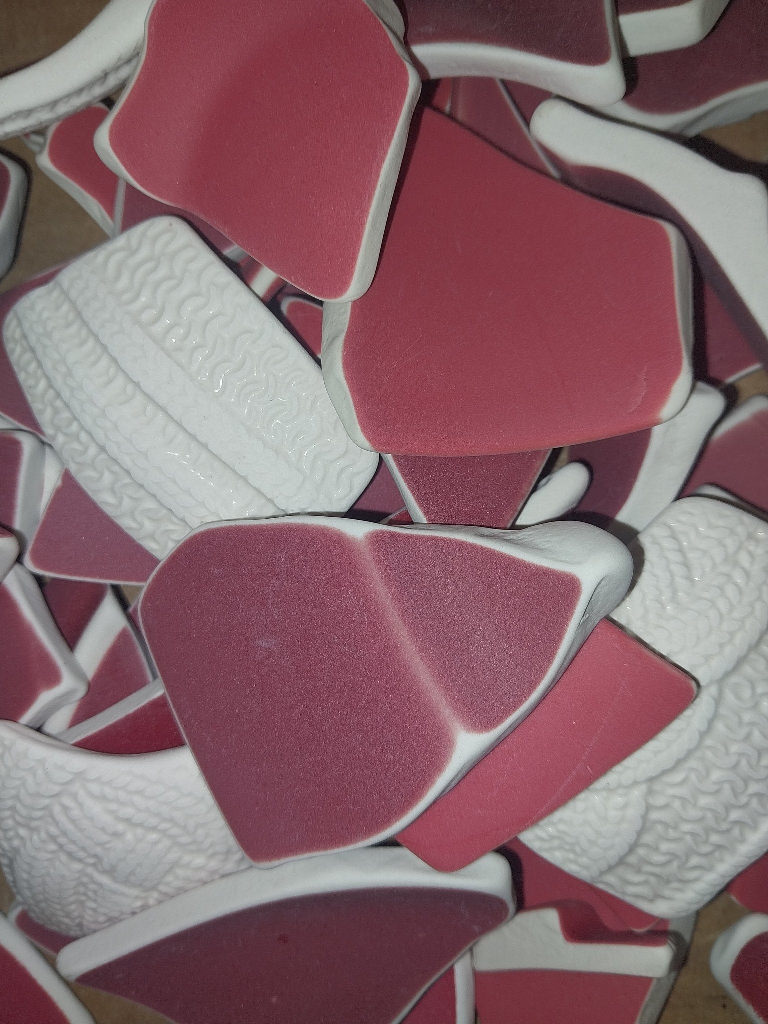 Assorted hand-tumbled pottery pieces in earthy colors for mosaic crafts