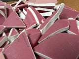 Assorted hand-tumbled pottery pieces in earthy colors for mosaic crafts