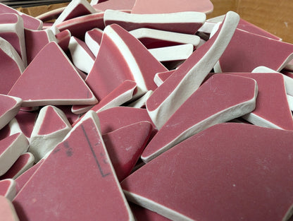 Assorted hand-tumbled pottery pieces in earthy colors for mosaic crafts