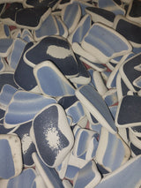 Assorted hand-tumbled pottery pieces in earthy colors for mosaic crafts