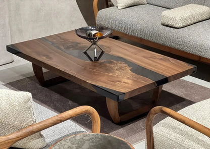 Handcrafted resin coffee table with smoke-colored resin river and solid walnut legs