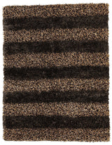 Handwoven Multi-Tone Shag Rug in a living room setting showing multi-color tones and fringed edges