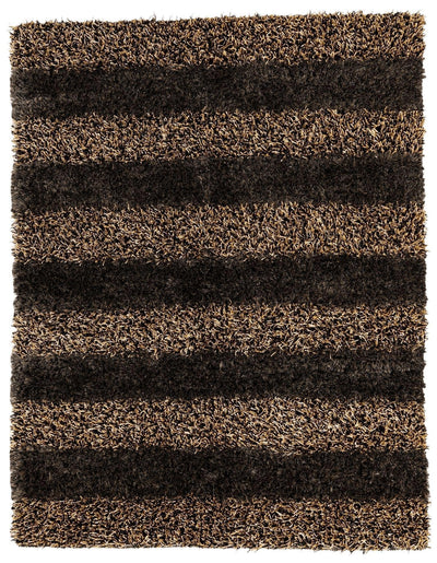 Handwoven Multi-Tone Shag Rug in a living room setting showing multi-color tones and fringed edges
